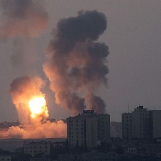 A picture taken from the southern Israeli border with the Gaza Strip shows smoke billowing during an Israeli air strike in the Palestinian coastal enclave, on July 8, 2014. Israeli warplanes killed at least 15 Palestinians in Gaza today, as well as another four militants who tried to infiltrate Israel by sea at the start of a major operation against rocketfire. AFP PHOTO / JACK GUEZ (Photo credit should read JACK GUEZ/AFP/Getty Images)