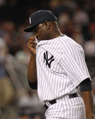 NEW YORK, NY - AUGUST 24: Rafael Soriano #29 of the New York Yankees walks to the dugout in the tenth inning after giving up a 3 RBI home run against the Oakland Athletics on August 24, 2011 at Yankee Stadium in the Bronx borough of New York City. (Photo by Nick Laham/Getty Images)