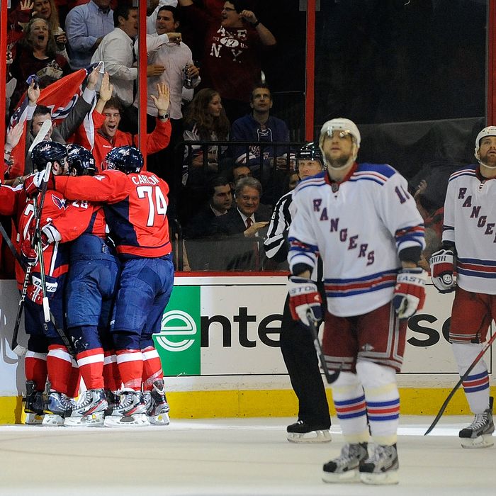 WASHINGTON, DC - MAY 09: The Washington Capitals celebrate after Jason Chimera #25 scored a goal against the New York Rangers in Game Six of the Eastern Conference Semifinals during the 2012 NHL Stanley Cup Playoffs at Verizon Center on May 9, 2012 in Washington, DC. (Photo by Patrick McDermott/Getty Images)