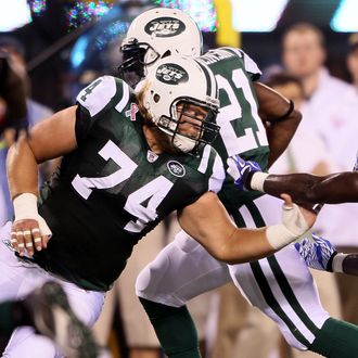 EAST RUTHERFORD, NJ - SEPTEMBER 11: Nick Mangold #74 of the New York Jets blocks against the Dallas Cowboys during their NFL Season Opening Game at MetLife Stadium on September 11, 2011 in East Rutherford, New Jersey. The Jets won 27-24. (Photo by Elsa/Getty Images)