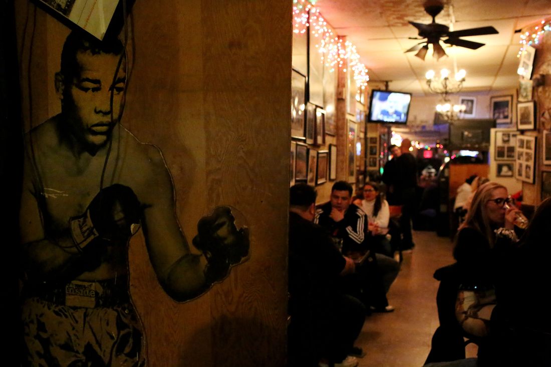 MANHATTAN, NY - NOVEMBER 06: Bar-goers mingle near a cutout of