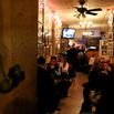 MANHATTAN, NY - NOVEMBER 06: Bar-goers mingle near a cutout of