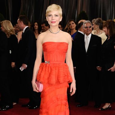 It’s still too close for us to call on this dress. On the pro side, we think the color is tremendous (some people said coral, but we call it orange), and there are some beautiful details here. But the peplum is a froof too far, as if it needed to pick one skirt idea and go with it, and the back’s inexplicable nude panel feels like somebody added it at the last minute because they realized the bodice wouldn’t stay up. In the end, we’re just glad someone with a naturally timid aura went so bold.