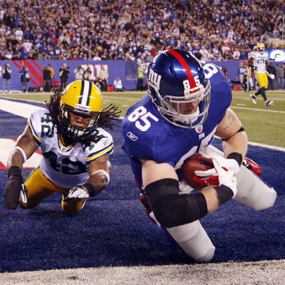 Green Bay Packers Morgan Burnett plays defense as New York Giants Jake Ballard as Ballard fails to get credit for a touchdown because he is called out of bounds in the first quarter in week 13 of the NFL season at MetLife Stadium in East Rutherford, New Jersey on December 4, 2011.