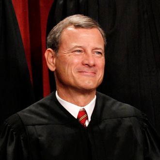 FILE - In this Oct. 8, 2010 file photo, Chief Justice John Roberts is seen during the group portrait at the Supreme Court Building in Washington. Breaking with the court's other conservative justices, Roberts announced the judgment that allows the law to go forward with its aim of covering more than 30 million uninsured Americans. Roberts explained at length the court's view of the mandate as a valid exercise of Congress' authority to 