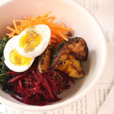 Grain bowl: red quinoa, seasonal vegetables, boiled egg, and sweet-soy vinaigrette.