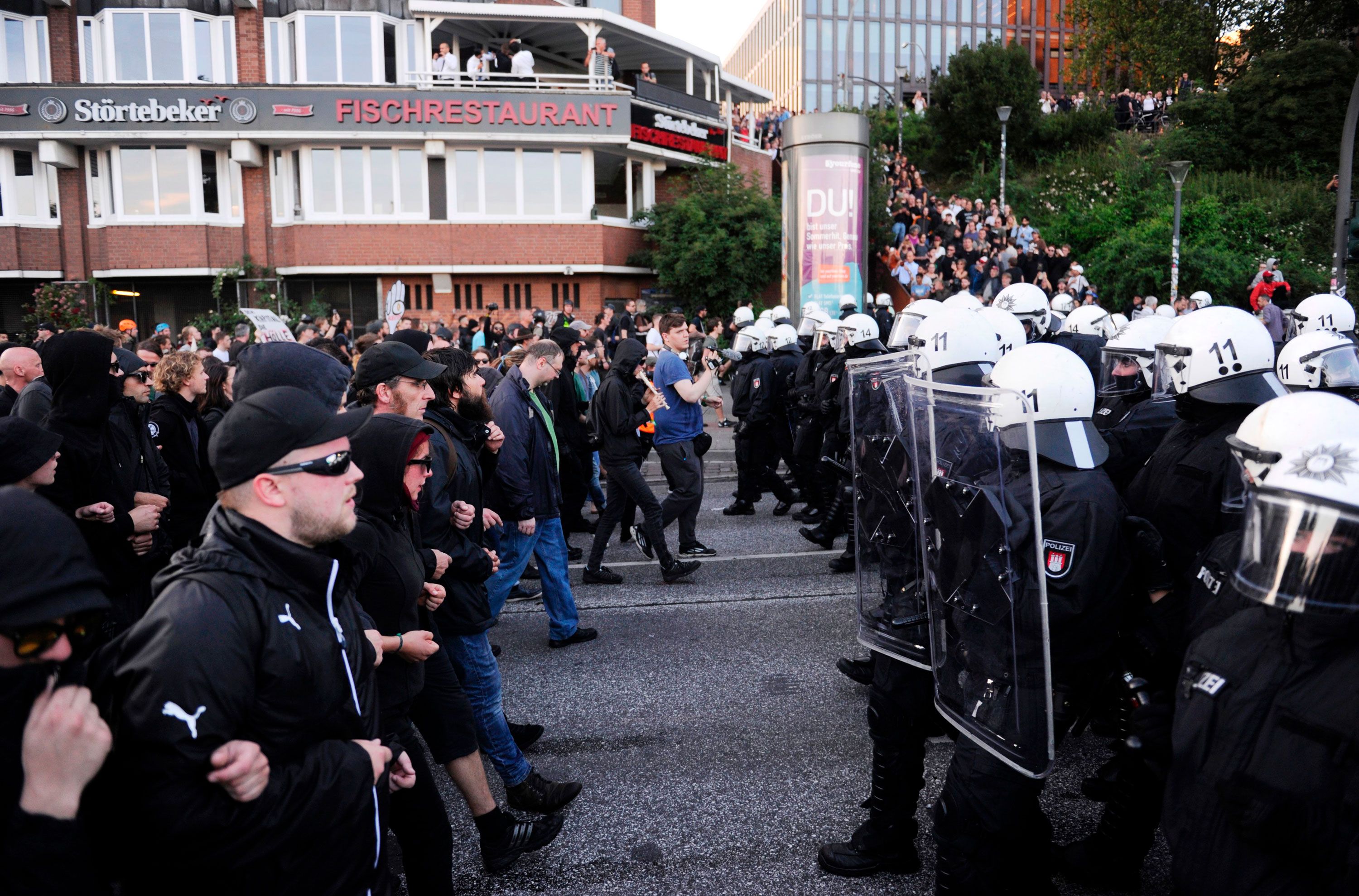 Police, protesters clash outside NATO summit