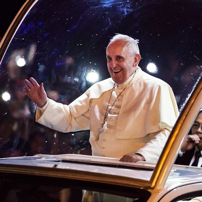 Pope Francis waves to the faithful upon his arrivalin Manila city on January 15, 2015 in Manila, Philippines. Pope Francis will visit venues across Leyte and Manila during his visit to the Philippines from January 15 - 19. The visit is expected to attract crowds in the millions as Filipino Catholics flock to catch a glimpse of the leader of the Catholic Church in the Philippines for the first time since 1995. The Pope will begin the tour in Manila, then travelling to Tacloban to visit areas devastated by Typhoon Haiyan before returning to Manila to hold a mass at Rizal Park. The Philippines is the only Catholic majority nation in Asia with around 90 percent of the population professing the faith.