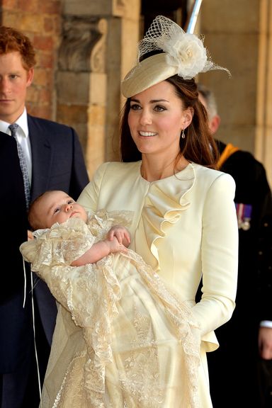 LONDON, ENGLAND - OCTOBER 23:  Catherine, Duchess of Cambridge carries her son Prince George Of Cambridge after his christening at the Chapel Royal in St James’s Palace, ahead of the christening of the three month-old Prince George of Cambridge by the Archbishop of Canterbury on October 23, 2013 in London, England. (Photo by John Stillwell - WPA Pool /Getty Images)