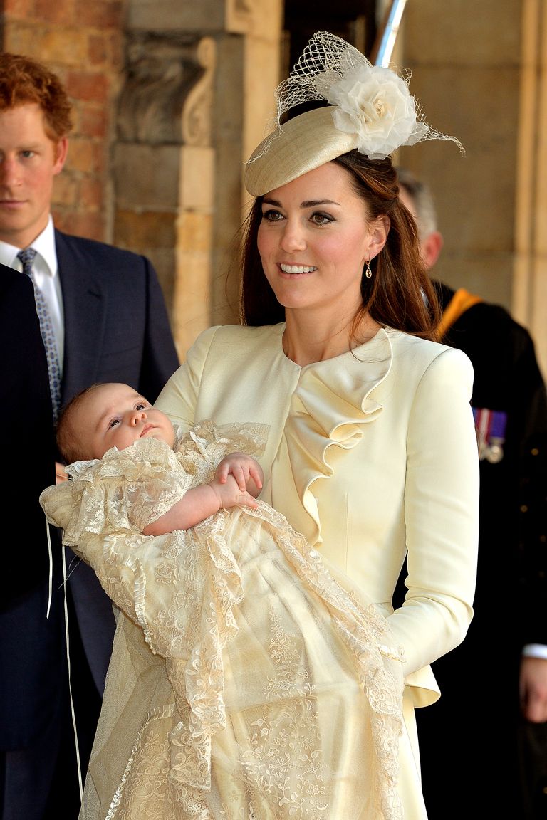 LONDON, ENGLAND - OCTOBER 23:  Catherine, Duchess of Cambridge carries her son Prince George Of Cambridge after his christening at the Chapel Royal in St James’s Palace, ahead of the christening of the three month-old Prince George of Cambridge by the Archbishop of Canterbury on October 23, 2013 in London, England. (Photo by John Stillwell - WPA Pool /Getty Images)