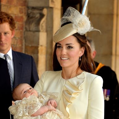 LONDON, ENGLAND - OCTOBER 23:  Catherine, Duchess of Cambridge carries her son Prince George Of Cambridge after his christening at the Chapel Royal in St James’s Palace, ahead of the christening of the three month-old Prince George of Cambridge by the Archbishop of Canterbury on October 23, 2013 in London, England. (Photo by John Stillwell - WPA Pool /Getty Images)