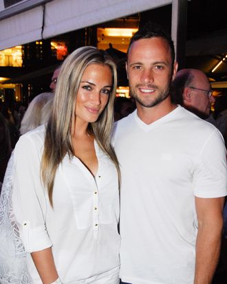 A picture taken on January 26, 2013 shows Olympian sprinter Oscar Pistorius posing next to his girlfriend Reeva Steenkamp at Melrose Arch in Johannesburg. South Africa's Olympic sprinter Oscar 