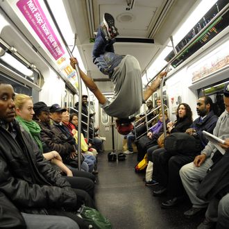 New York City Subway dancer Marcus Walden ( Mr Wiggles) performs with other members of his dance crew November 23, 2010. The dance crew of Donte Steele (Thebestuknow); Tamiek Steele ( B/Boy LJ) and Marcus Walden ( Mr Wiggles) perform their roughly 45-second routine between stops on the train running from 125th Street in Harlem to the Brooklyn Bridge. 