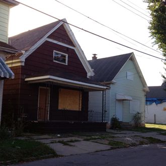 These homes on Deshler Street in Buffalo, N.Y. are among five houses on the street that were owned by Theresa Anderson and used in her drug trafficking business. Anderson, 58, faces 14 to 17 1/2 years in prison when she is sentenced Oct. 8 for running a 12-year operation that monopolized crack cocaine sales in the area and employed her grown children and close acquaintances. (AP Photo/Carolyn Thompson)