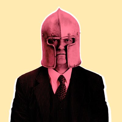 Businessman in medieval helmet