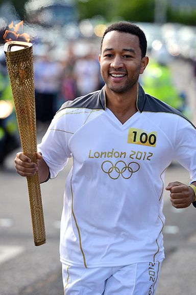 The Best Part of This Picture Is… guesstimating the weather conditions that day based solely on John Legend's perky nipples.
Is This Person Worthy to Carry the Torch? Sorry, will.i.am. Did you sing "Save Room"? No? Then John Legend gets to stay.