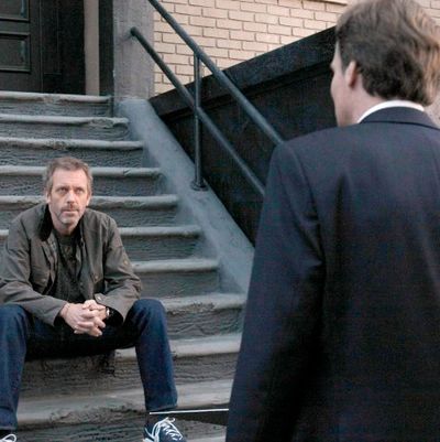 HOUSE: House (Hugh Laurie, L) has some news for Wilson (Robert Sean Leonard, R)