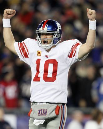 Eli Manning #10 of the New York Giants celebrates after the game winning touchdown in the fourth quarter against the New England Patriots on November 6, 2011.