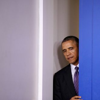 WASHINGTON, DC - APRIL 17: U.S. President Barack Obama steps out into the Brady Press Briefing Room before delivering remarks about Obamacare and the ongoing tensions in Ukraine in the Brady Press Briefing Room at the White House April 17, 2014 in Washington, DC. Secretary of State John Kerry and his counterparts from Russia, Ukraine and the EU issued a joint statement today on the crisis in Ukraine calling for all illegal armed groups to be disarmed, all illegally seized buildings to be returned to their owners, and for all occupied public spaces to be vacated. (Photo by Chip Somodevilla/Getty Images)