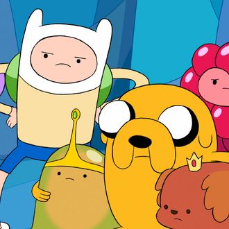 Finn is in the middle, with the skinny arms. Jake is the dog. Together, they have <em>Adventure Time</em>.
