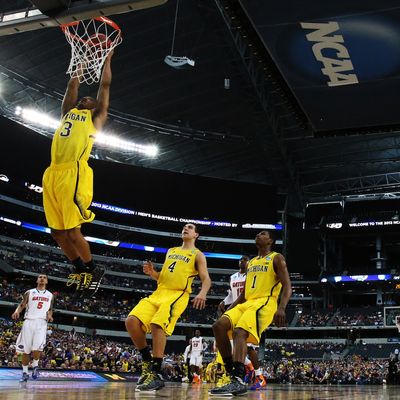 Trey Burke #3 of the Michigan Wolverines goes up against the Florida Gators in the first half during the South Regional Round Final of the 2013 NCAA Men's Basketball Tournament at Dallas Cowboys Stadium on March 31, 2013 in Arlington, Texas.