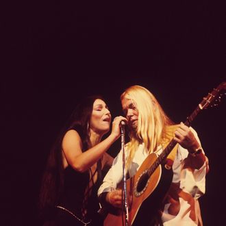 Cher and Gregg Allman perform on stage at the Rainbow Theatre in London, England