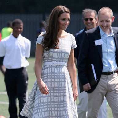 LONDON, ENGLAND - JULY 26:  Catherine, Duchess of Cambridge kicks a football on the football pitch as she visits Bacon’s College on July 26, 2012 in London, England. Prince Harry, Prince William, Duke of Cambridge and Catherine, Duchess of Cambridge visited Bacon’s College and launched the ‘Coach Core’ Programme, a partnership between their Foundation and Greenhouse.  (Photo by Chris Jackson/Getty Images)