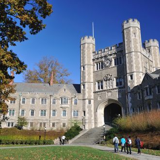 Princeton, New Jersey, USA - November 5, 2011. A group of students walking towards clock tower of Blair Hall in Princeton University. Princeton University, located in Princeton, New Jersey, is one of the most prestigious universities in the world. Chartered in 1746, it is the fourth-oldest college in the United States. Princeton University provides undergraduate and graduate education in the humanities, social sciences, natural sciences and engineering.