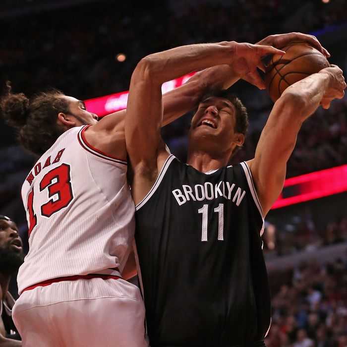 CHICAGO, IL - APRIL 25: Joakim Noah #13 of the Chicago Bulls fouls Brook Lopez #11 of the Brooklyn Nets in Game Three of the Eastern Conference Quarterfinals during the 2013 NBA Playoffs at the United Center on April 25, 2013 in Chicago, Illinois. NOTE TO USER: User expressly acknowledges and agrees that, by downloading and or using this photograph, User is consenting to the terms and conditions of the Getty Images License Agreement. (Photo by Jonathan Daniel/Getty Images)