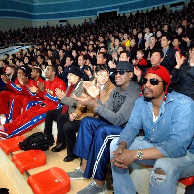 In this image released by the Korean Central News Agency (KCNA) and distributed by the Korea News Service, former NBA star Dennis Rodman, second right in front row, visits a dolphin aquarium in Pyongyang in North Korea Friday, March 1, 2013. Ending his unexpected round of basketball diplomacy in North Korea on Friday, Rodman called leader Kim Jong Un an 