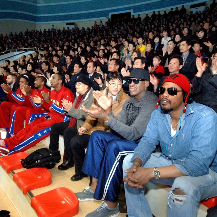 In this image released by the Korean Central News Agency (KCNA) and distributed by the Korea News Service, former NBA star Dennis Rodman, second right in front row, visits a dolphin aquarium in Pyongyang in North Korea Friday, March 1, 2013. Ending his unexpected round of basketball diplomacy in North Korea on Friday, Rodman called leader Kim Jong Un an