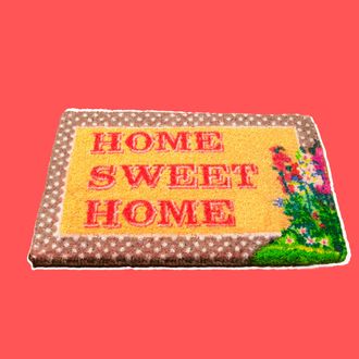 Home sweet home doormat on wooden floor