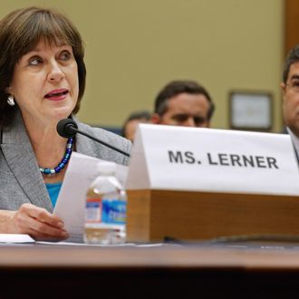 Internal Revenue Service Director of Exempt Organizations Lois Lerner (L) makes a statement during a hearing of the House Oversight and Government Reform Committee with Deputy Treasury Secretary Neal Wolin May 22, 2013 in Washington, DC. The committee is investigating allegations that the IRS targeted conservative non-profit organizations with the words 