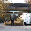 Suffolk County homicide detective and crime lab investigators look over scene of apparent murder