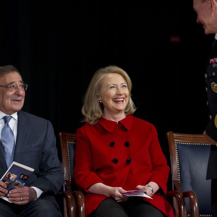 US Secretary of Defense Leon Panetta and former Secretary of State Hillary Clinton speak with Chairman of the Joint Chiefs Martin Dempsey (R) prior to Clinton receiving awards from Panetta and Dempsey during a ceremony at the Pentagon in Washington, DC, February 14, 2013.