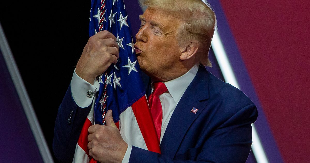 Watch Trump Fondle an American Flag at CPAC