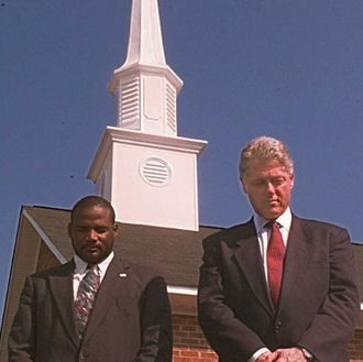 US President Bill Clinton (R) and Rev. Terrence Ma