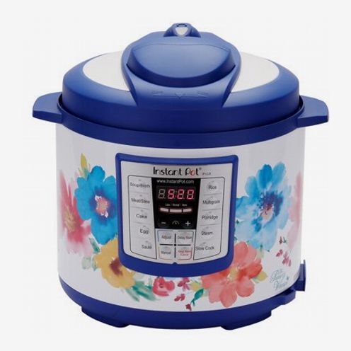 The Pioneer Woman instant pot with a colorful watercolor floral print on a white back ground with blue lid and handle accents. The Strategist - 48 Things on Sale You’ll Actually Want to Buy: From Sunday Riley to Patagonia