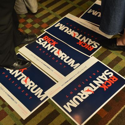 Campaign posters lie idle as preparations are made shortly before a primary night campaign rally for Republican presidential candidate Rick Santorum April 3, 2012 at the Four Points Sheraton Hotel in Mars, Pennsylvania. Republican primaries are being held April 3rd in Wisconsin, Maryland, and Washington, DC. AFP Photo/Paul J. Richards (Photo credit should read PAUL J. RICHARDS/AFP/Getty Images)