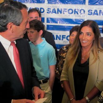 Former South Carolina Gov. Mark Sanford thanks his fiance Maria Belen Chapur as he addresses supporters in Mount Pleasant, S.C., on Tuesday, April 2, 2013, after winning the GOP nomination for the U.S. House seat he once held. Sanford is trying to make a comeback after his political career was derailed four years ago when he disappeared from the state only to return to admit the couple was having an affair. Sanford's wife, Jenny, later divorced him. (AP Photo/Bruce Smith)