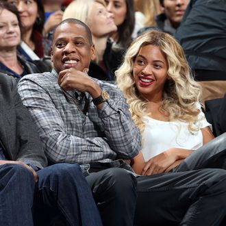 Jay-Z and Beyonc? sit courtside during the Oklahoma City Thunder game against the Los Angeles Clippers on November 21, 2013 at the Chesapeake Energy Arena in Oklahoma City, Oklahoma. 