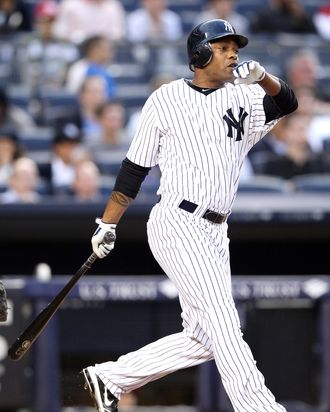 Dewayne Wise #45 of the New York Yankees watches his two run homer against the Cleveland Indians on June 25, 2012