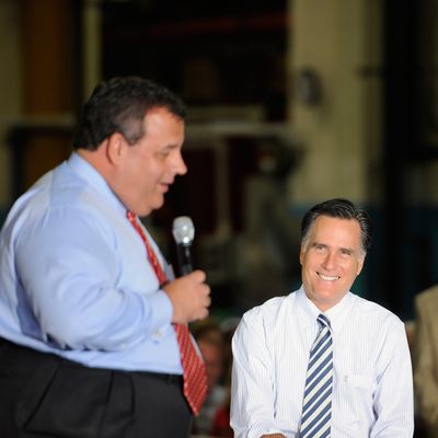 MOUNT VERNON, OH - OCTOBER 10: Republican presidential candidate, former Massachusetts Gov. Mitt Romney (R) listens as New Jersey Gov. Chris Christie speaks to the crowd at Ariel Corporation on October 10, 2012 in Mount Vernon, Ohio. Romney is campaigning in Ohio with less than a month to go before the general election. (Photo by Jamie Sabau/Getty Images)