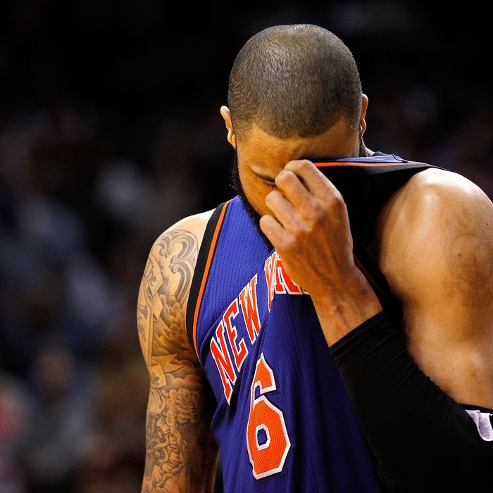 MIAMI, FL - JANUARY 27: Tyson Chandler #6 of the New York Knicks wipes his face during a game against the Miami Heat at American Airlines Arena on January 27, 2012 in Miami, Florida. NOTE TO USER: User expressly acknowledges and agrees that, by downloading and/or using this Photograph, User is consenting to the terms and conditions of the Getty Images License Agreement. (Photo by Mike Ehrmann/Getty Images)