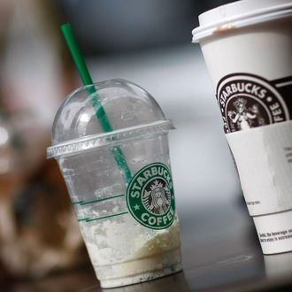 WEST PALM BEACH, FL- JULY 1: Starbucks drinks sit on a table outside a store on the day that Starbucks Corp. said that it plans to close 600 company-operated stores in the United States July 1, 2008 in West Palm Beach, Florida. The company said the job cuts with the store closings represent about 7 percent of Starbucks' global workforce. (Photo by Joe Raedle/Getty Images)
