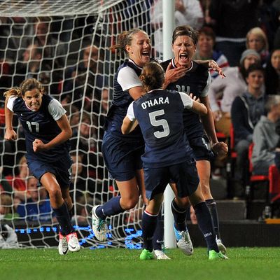 US forward Abby Wambach (L) celebrates scoring a penalty during the London 2012 Olympic women's football semi final match between the US and Canada at Old Trafford in Manchester, north-west England, on August 6, 2012.