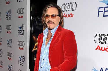 Mickey Rourke shows bizarre style choices with shades worn OVER