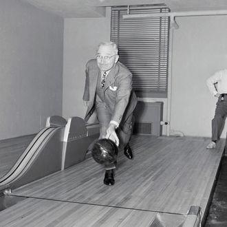 19 Apr 1948, Washington, DC, USA --- Original caption: Washington, D. C....Down The Alley With Truman. Harry S. Truman, the Missouri Southpaw, followed form today when he inaugurated the newly installed bowling alleys in the basement at the White House, and threw the first ball with his left arm, knocking down seven pins. The alleys were installed as a birthday gift to the president, but he likes pitching horseshoes better. --- Image by ? Bettmann/CORBIS