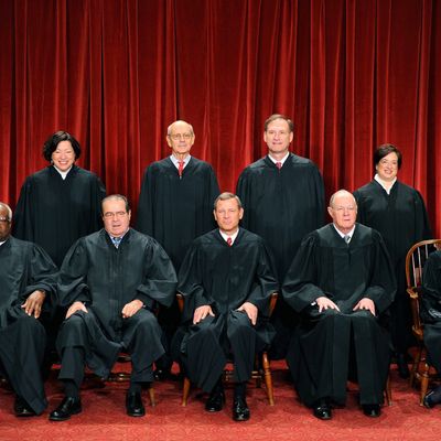 The Justices of the US Supreme Court sit for their official photograph on October 8, 2010 at the Supreme Court in Washington, DC. 