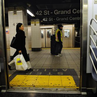 Commuters walks on a platform after disembraking from a train at a subway station in New York, November 21, 2008. The New York Metropolitan Transportation Authorithy (MTA) said that to plug a 1.2 billion USD budget gap next year, it must increase fare and toll revenues by 23 percent, which would raise an additional 670 USD million if the increase goes into effect in early June. AFP PHOTO/Emmanuel Dunand (Photo credit should read EMMANUEL DUNAND/AFP/Getty Images)